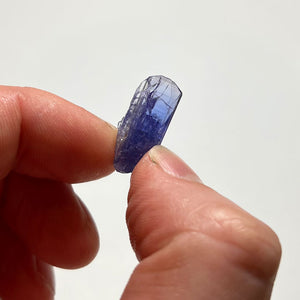 heated tanzanite in hand