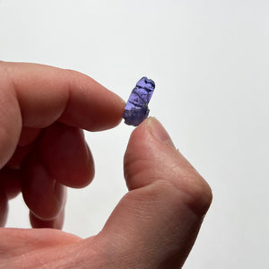 tanzanite crystal in hand thumbnail size