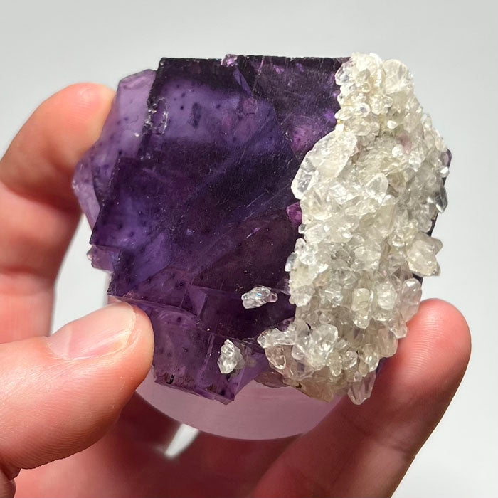 purple fluorite crystal with calcite