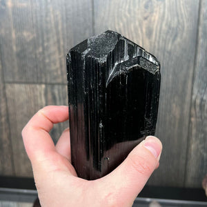 size of natural tourmaline in a hand 